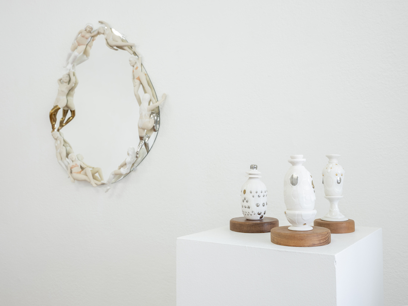 Perfume bottles and mirror installation shot together